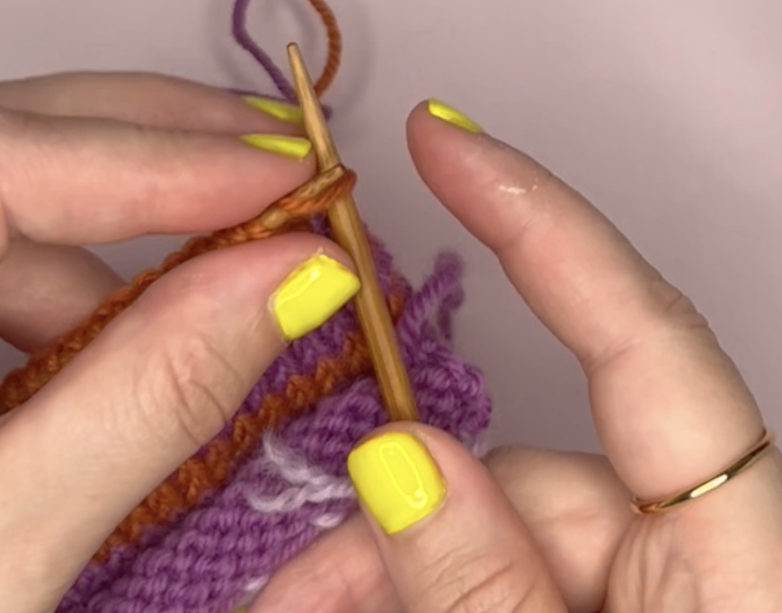 inserting the left knitting needle into the first stitch on the right needle